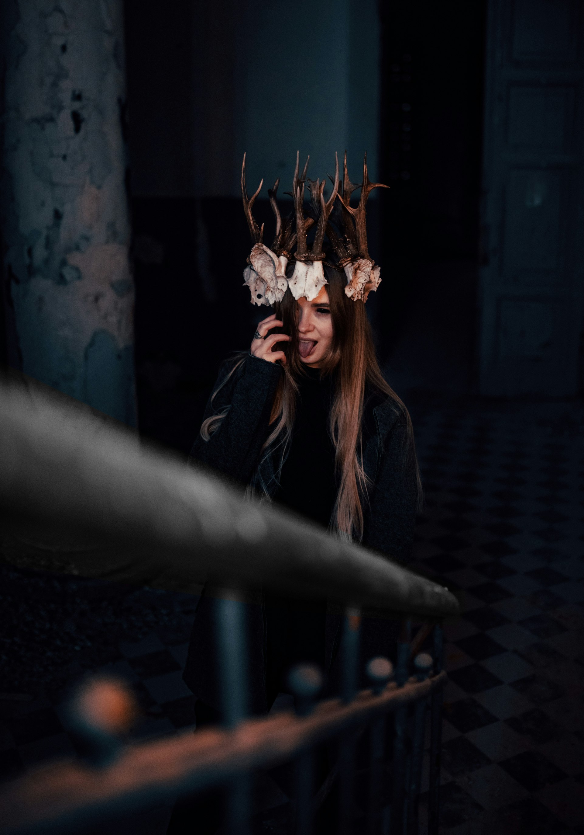 woman in black leather jacket holding brown dried leaf